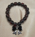 Handmade black bow bracelet with gothic red and black beads and bow charm, dark coquette jewellery Australia