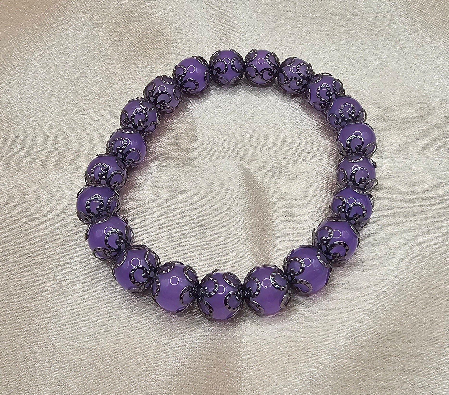 Handmade lavender purple glass beaded bracelet with black filigree spacers, elegant coquette jewellery Australia