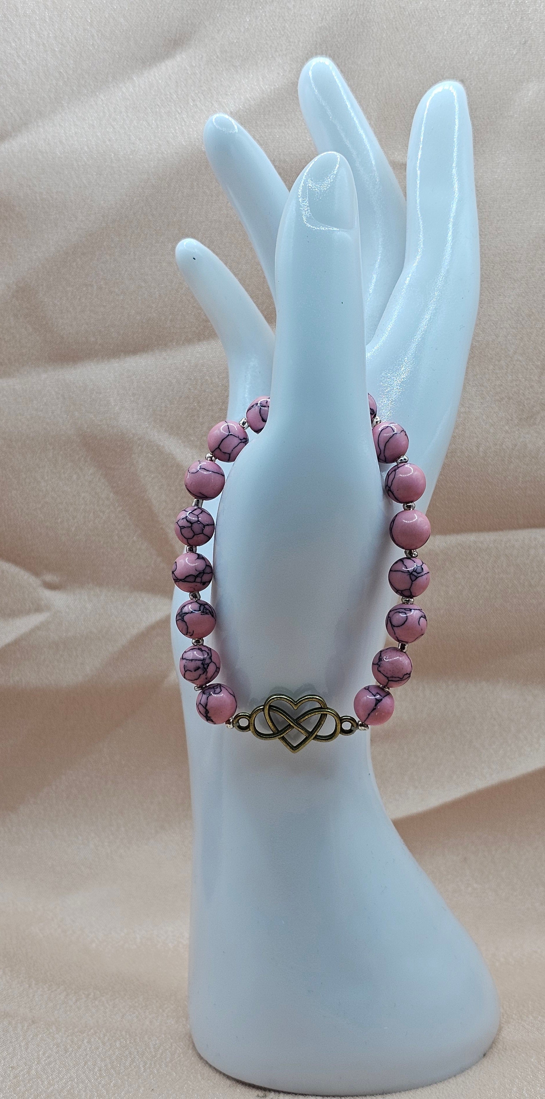 Pink beaded bracelet with Infinity Charm
