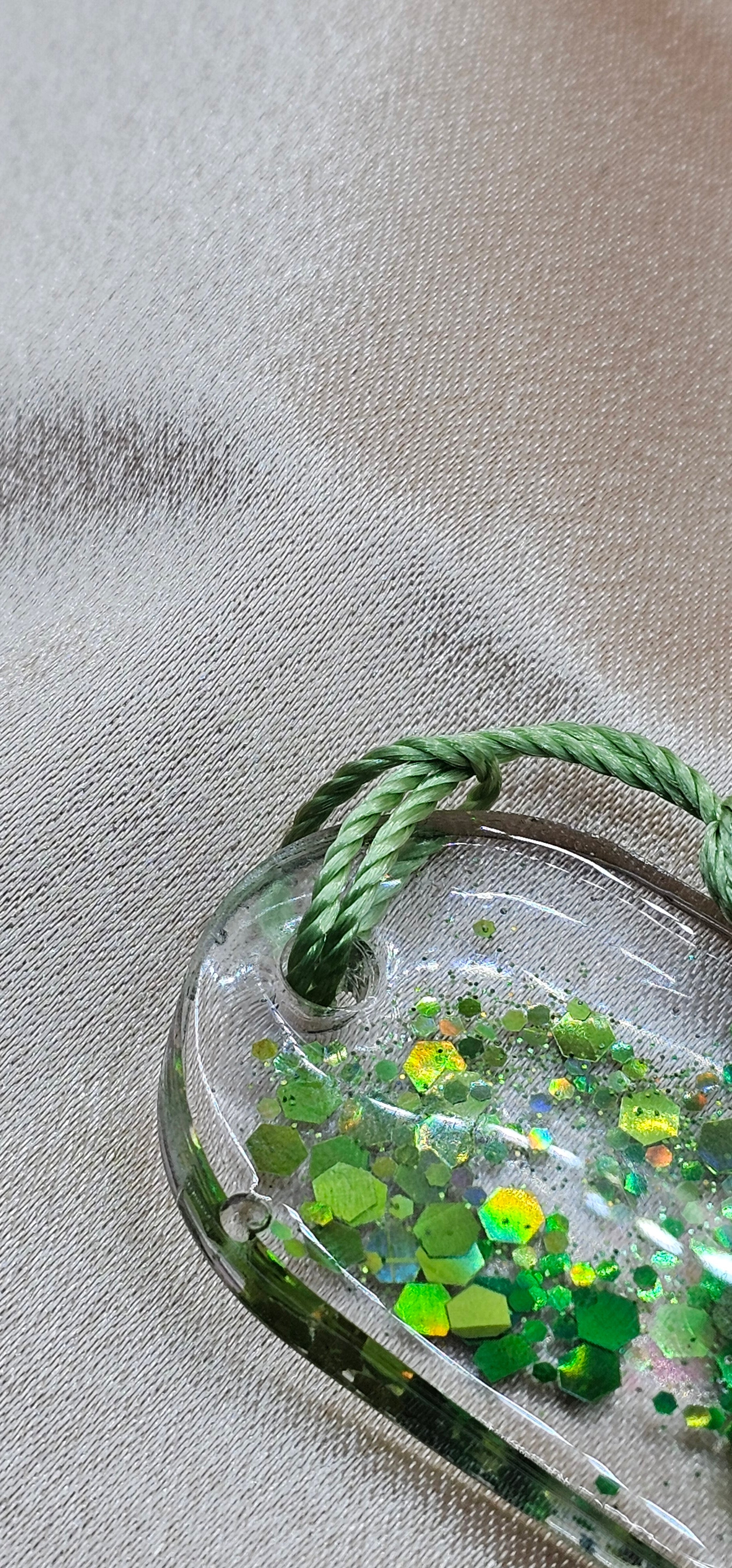 Handmade enchanted forest resin bookmark with real pressed ferns, holographic glitter & sage tassel. Cottagecore & fairycore book accessory handmade in Australia.