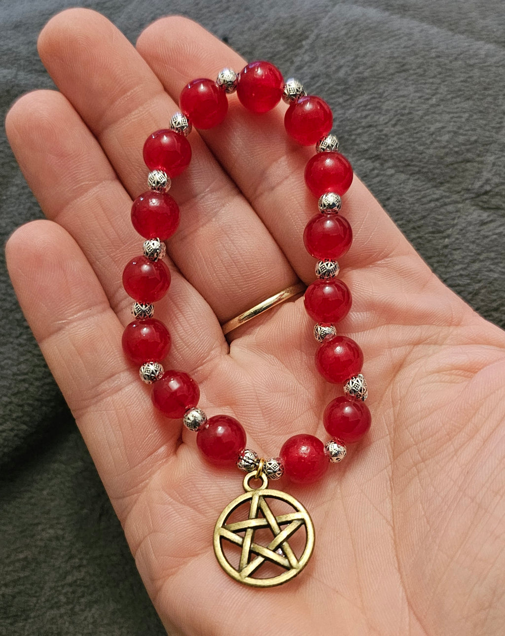 Handmade carnelian pentagram bracelet with red beaded stretch and bronze pentacle, witchy jewellery Australia