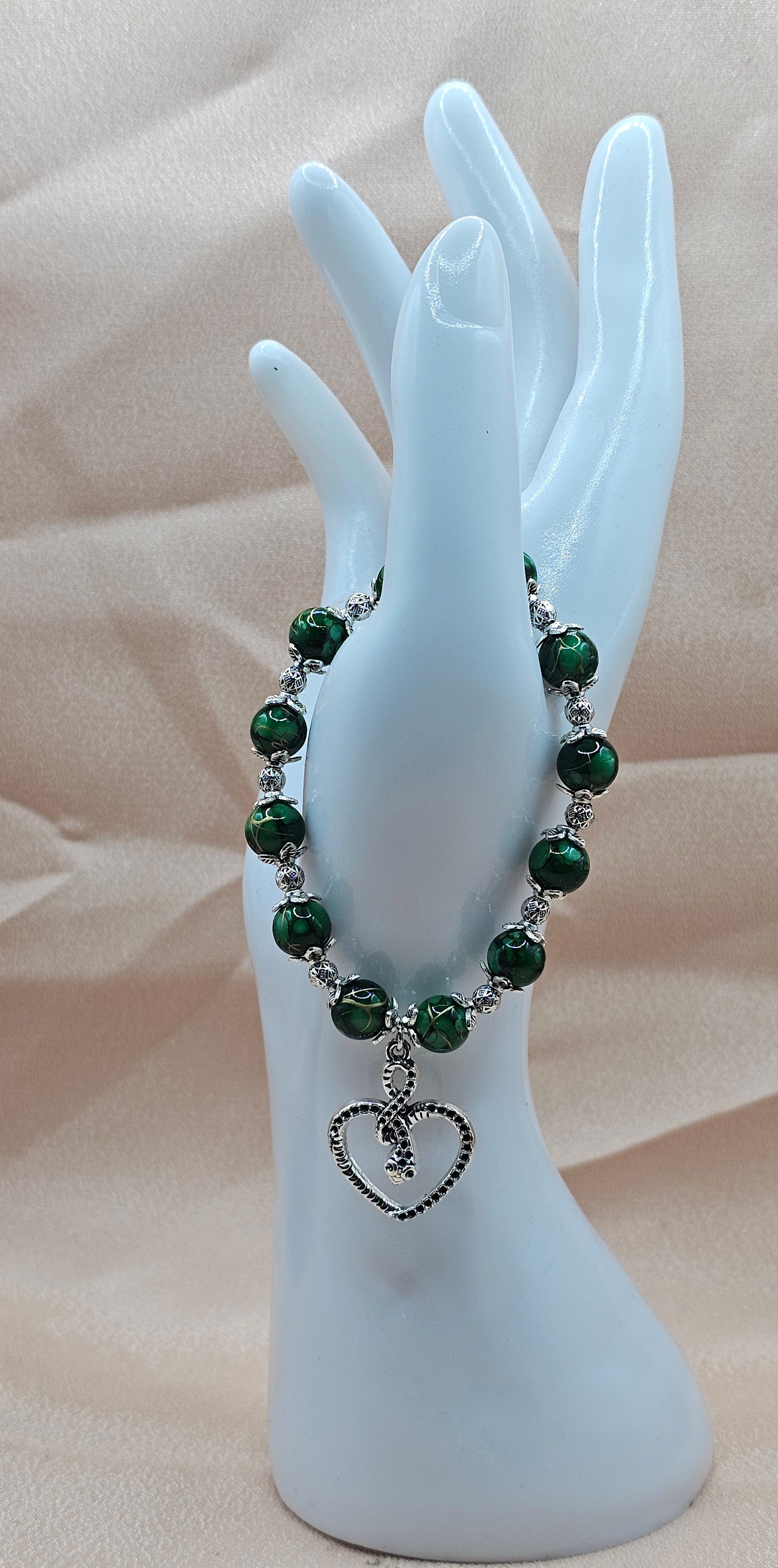 Handmade green malachite bracelet with serpent heart charm and silver filigree, dark feminine jewellery Australia