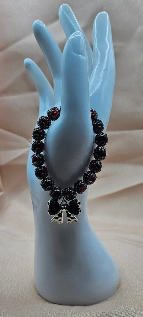 Handmade black bow bracelet with gothic red and black beads and bow charm, dark coquette jewellery Australia