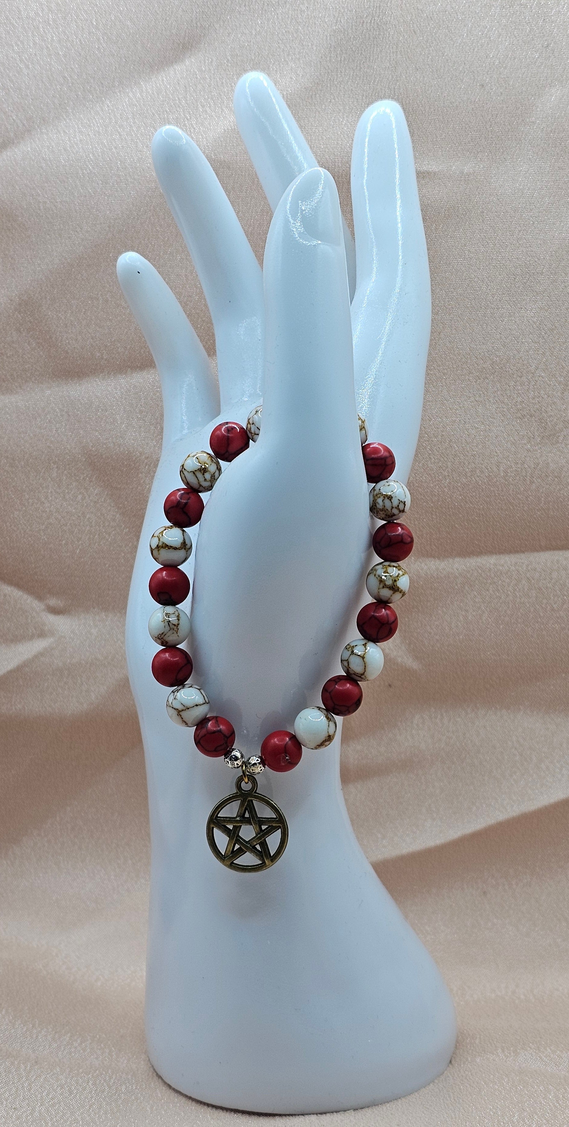 Handmade red and white crackle bead bracelet with bronze pentagram charm, witchy jewellery Australia